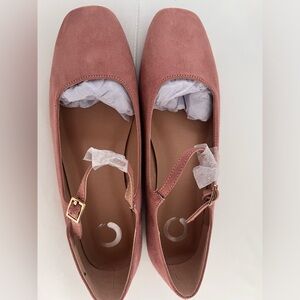 Pink suede Mary Jane ballet flats with gold buckle, featuring a 3" heel